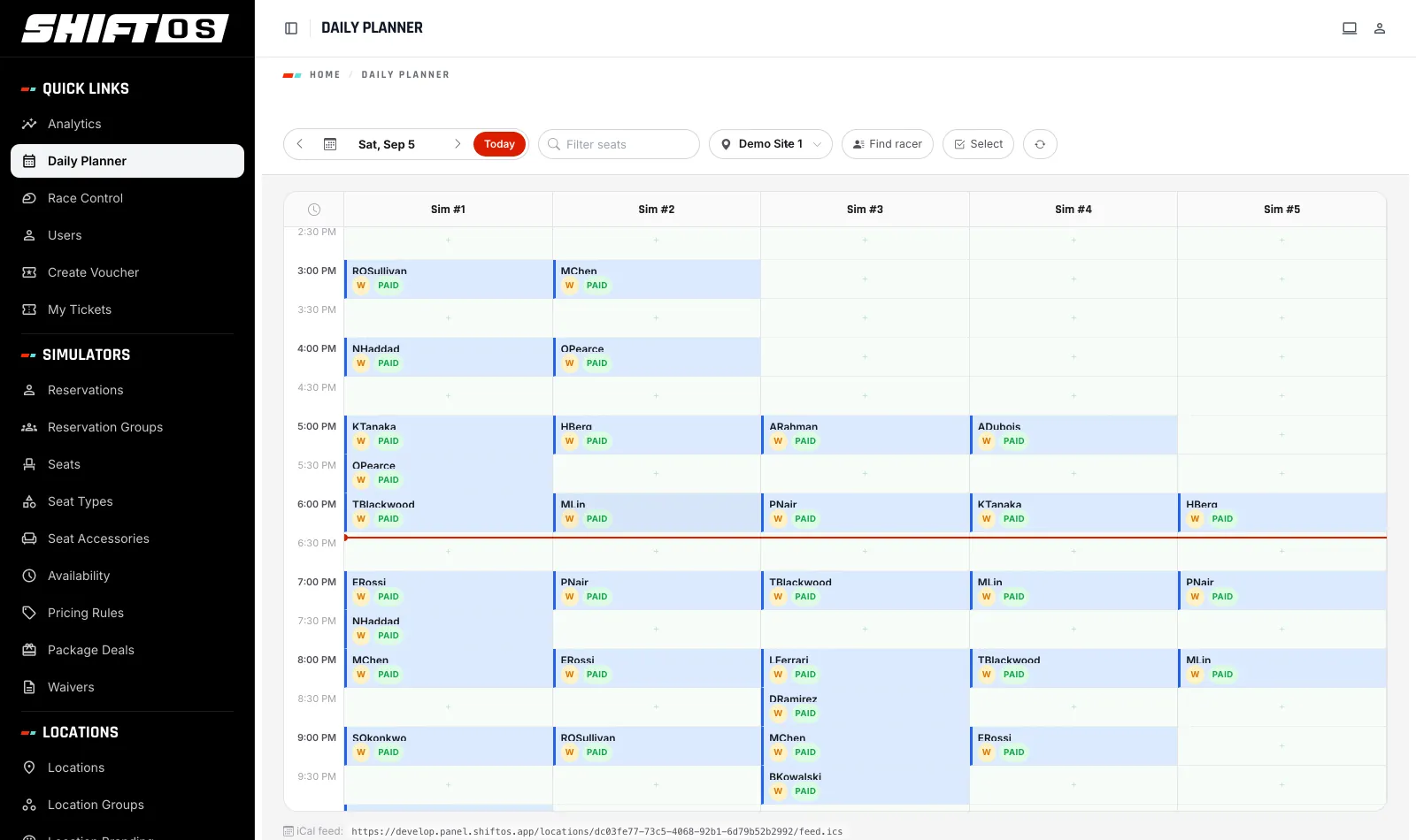 The Daily Planner grid for one day, every simulator against every time slot, with paid bookings in place